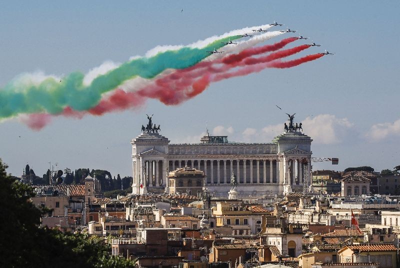 The Frecce Tricolori (Tricolor Arrows) aerobatic squad of the Italian Air Force fly over Rome and the Unknown Soldier monument, visible in foreground, Tuesday, June 2, 2020, as part of the celebrations for the 74th anniversary of the Italian Republic born on June 2, 1946. (Photo by Alessandra Tarantino/AP Photo)